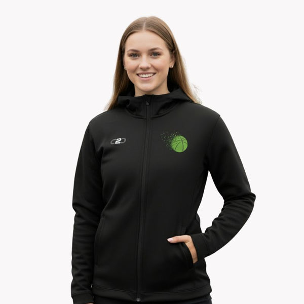 Woman smiling in a black Express Glide SlimFit HP Tech zip hoodie with a green basketball logo and hand in pocket.