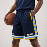 A person wearing navy Miners Core Shorts Pro with yellow and light blue side stripes and “MINERS” branding, shown on a light neutral background. No side seam design, above-knee fit, breathable moisture-wicking fabric, and customisable team shorts.
