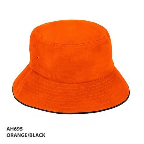 An orange and black bucket hat with a wide brim, featuring a logo on the side.