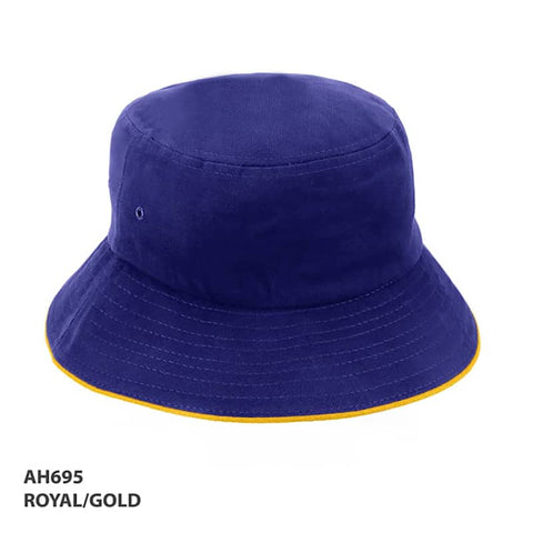 A royal blue bucket hat with a gold trim and a logo on the side.